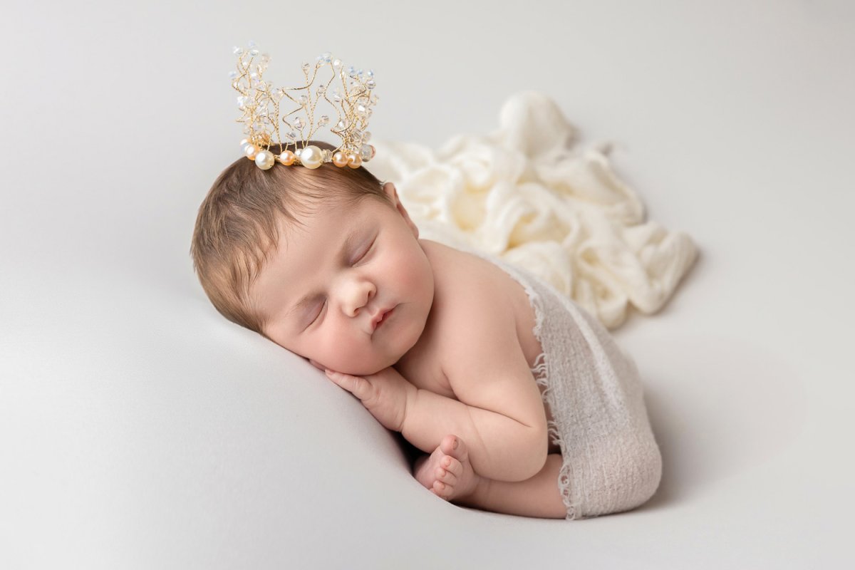 Beautiful newborn baby sleeping peacefully with a delicate crown, captured at Blossom Brook Studio – Newborn Photography Sydney.