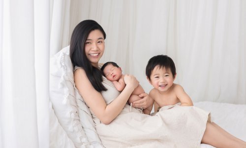 Mother with newborn and child together.