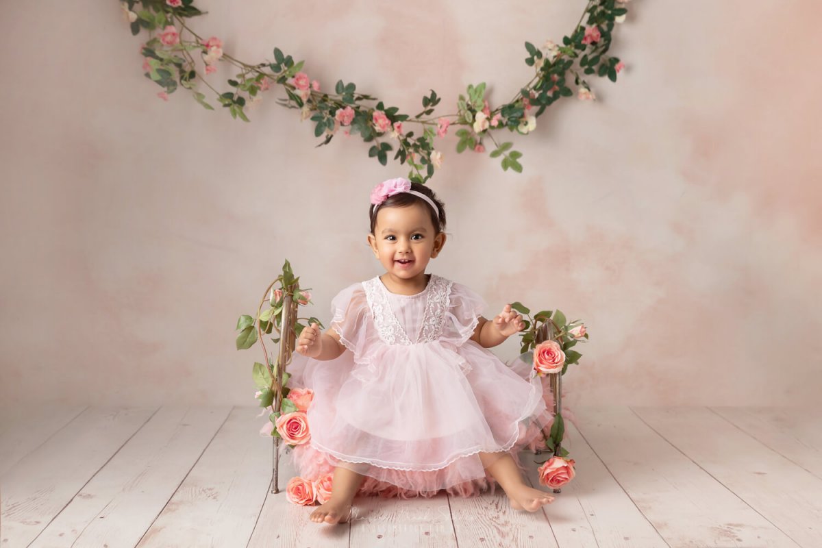 baby one year old photoshoot in sydney baby girl pink wooden floor