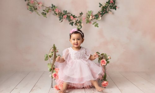 baby one year old photoshoot in sydney baby girl pink wooden floor