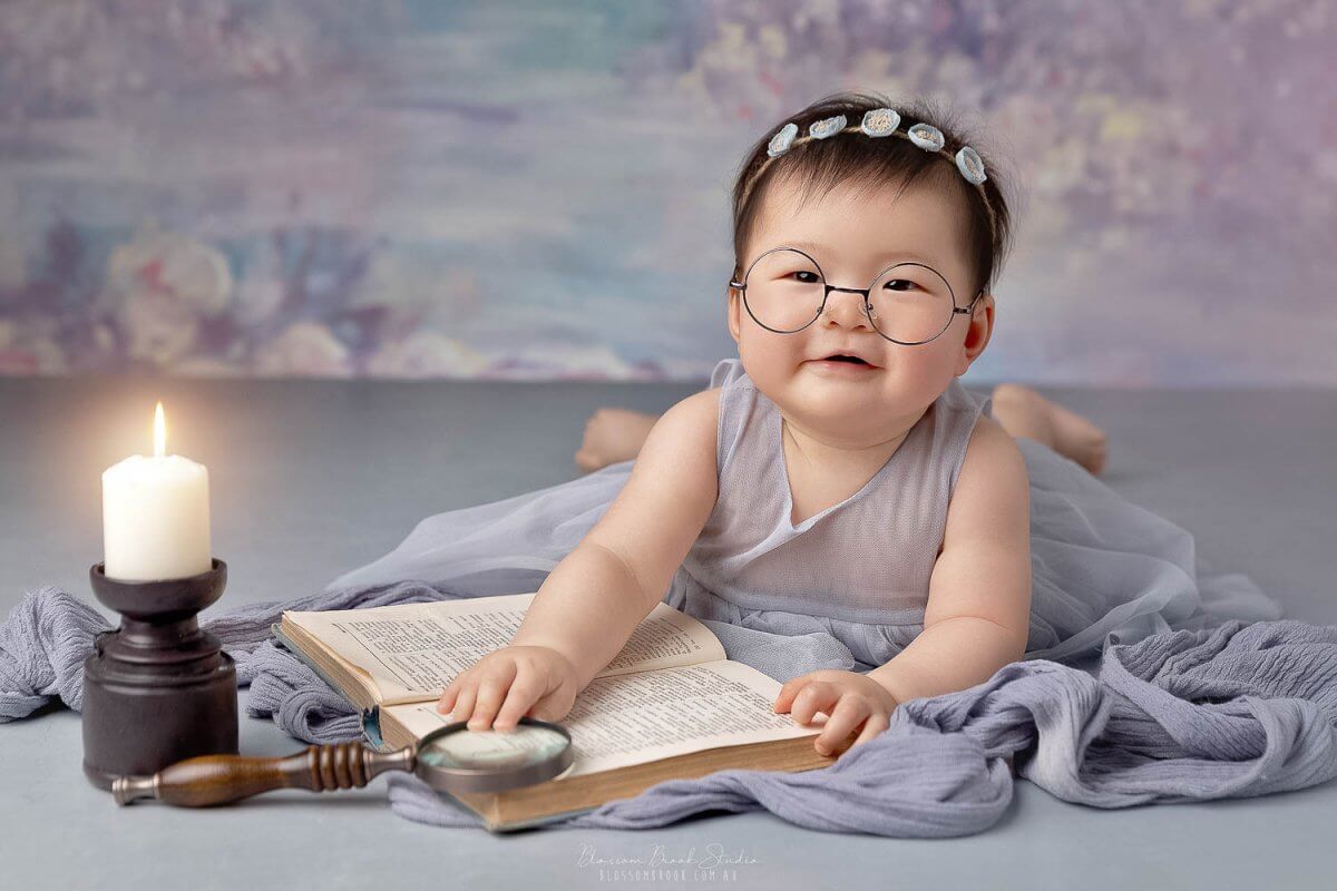 baby reading with glasses photo sydney