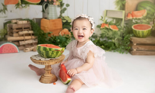 baby photoshoot with watermelon smash theme baby girl laughing