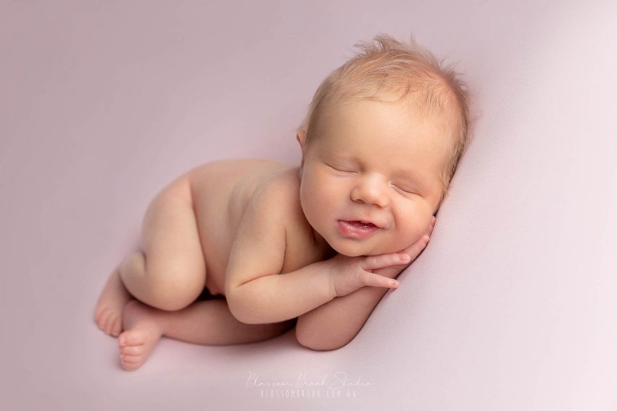 newborn baby smile pink