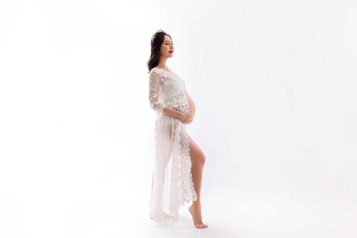 pregnant lady in white dress pregnancy shoot